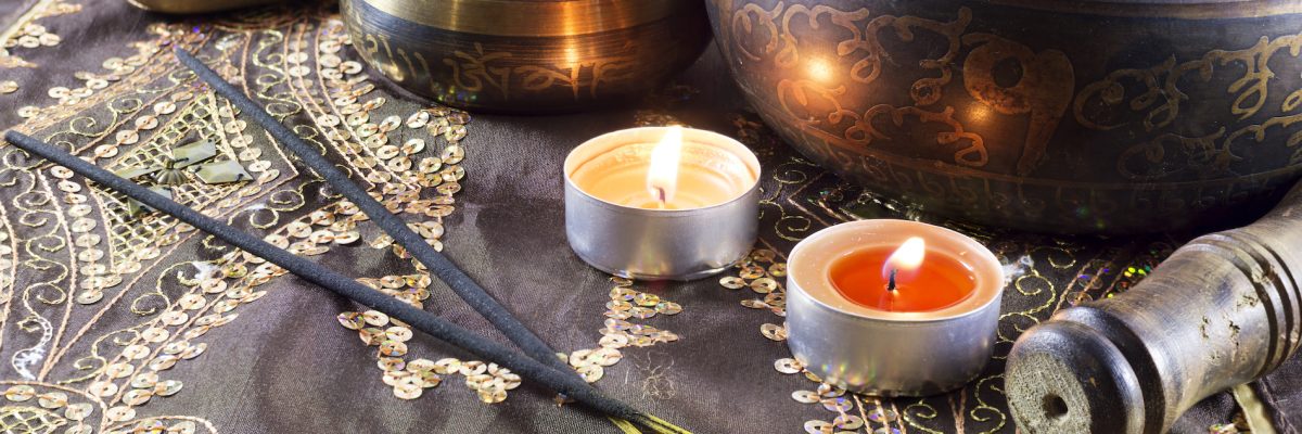 Still life with singing bowls and candles